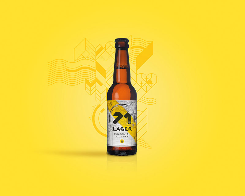 Brown 71 Lager bottle sits on yellow background infront of geometic pattern.